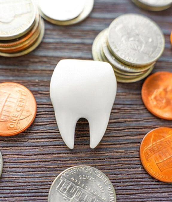 a tooth surronded by voins representing cost of dental crowns