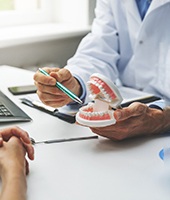 A man consulting with his dentist about implants