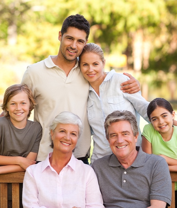 family of six smiling all together