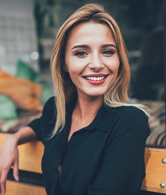 woman smiling with dental bridges in Mansfield