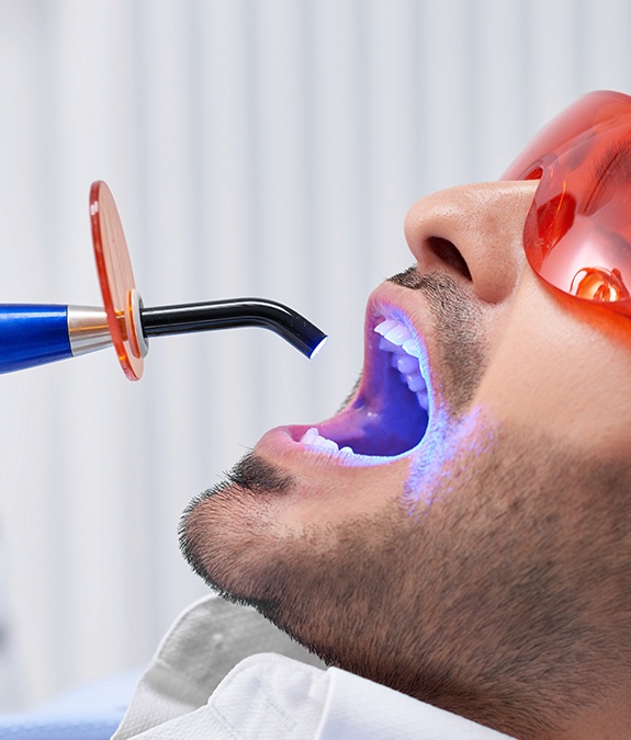 man getting cosmetic dental bonding done