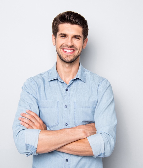 Man smiling with dental crowns in Mansfield 