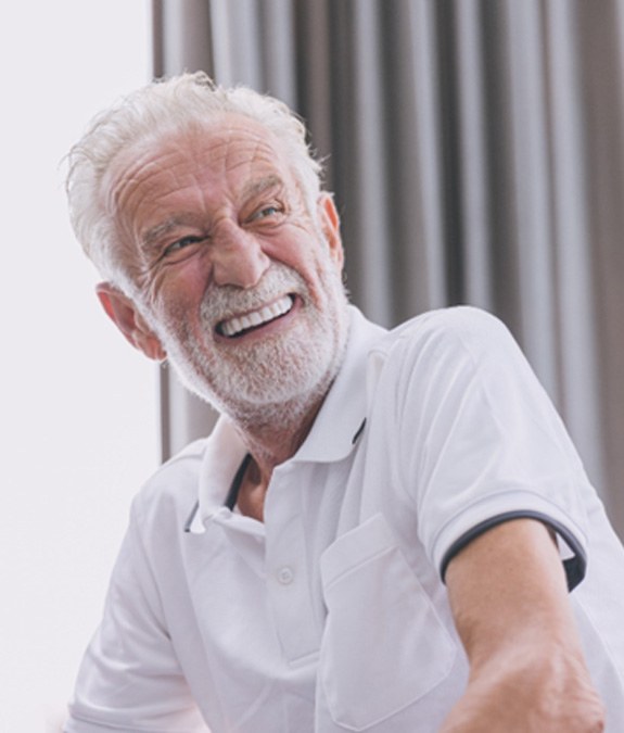 Woman holding dentures