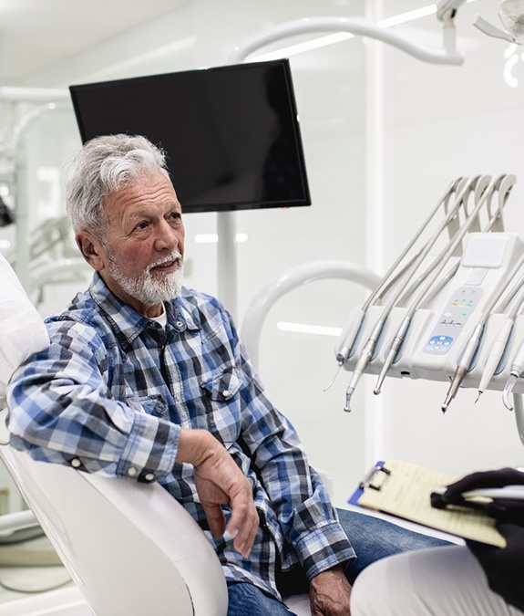 Man learning about cost of treating dental emergencies in Mansfield