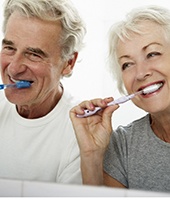 Couple brushing teeth in Mansfield