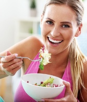 Woman eating salad in Mansfield