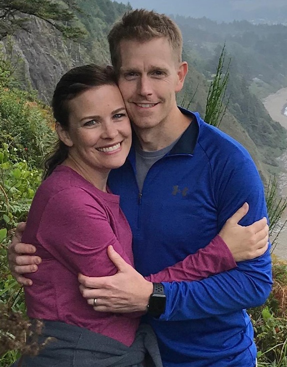 Dr. Judd and wife smiling on mountain