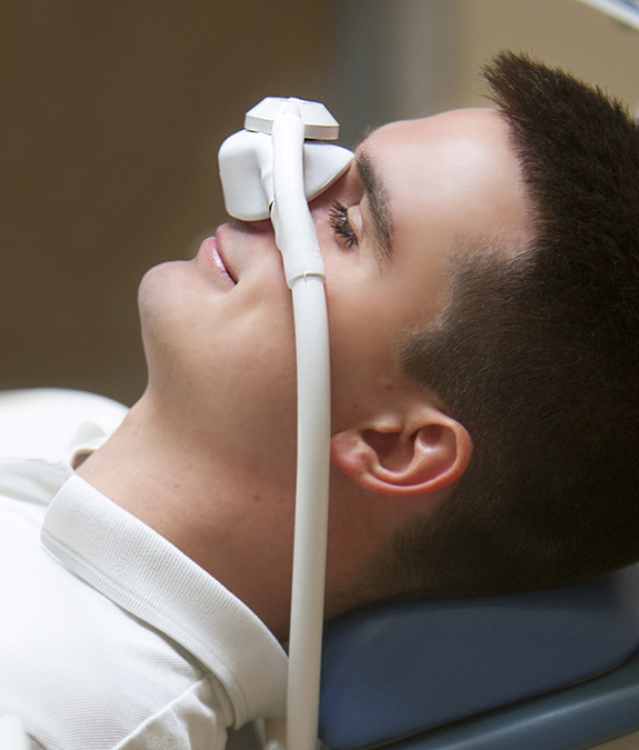 man receiving nitrous oxide from sedation dentist in Mansfield  