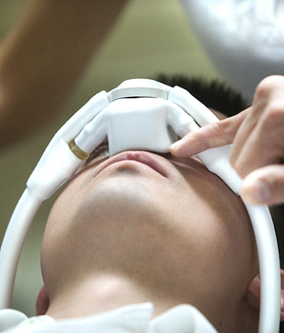 Young man breathing in nitrous oxide through nasal mask