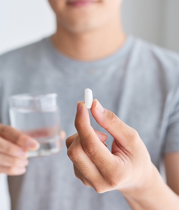 close up of oral conscious sedative pill man is holding