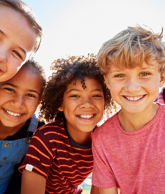 Happy group of children in outdoor setting