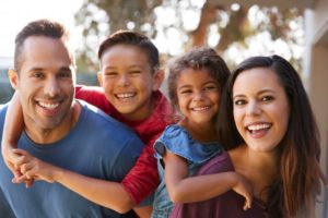 Family smiling after visiting dentist in Mansfield