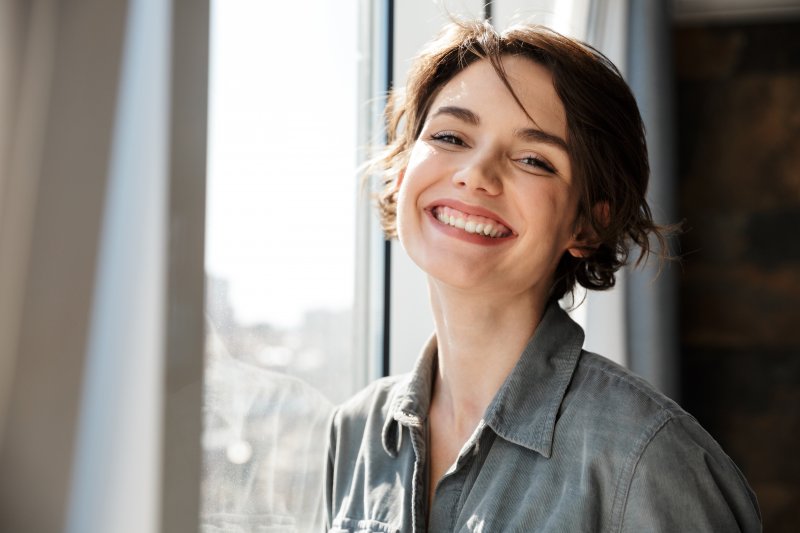 Woman Smiling with her new dental veneers